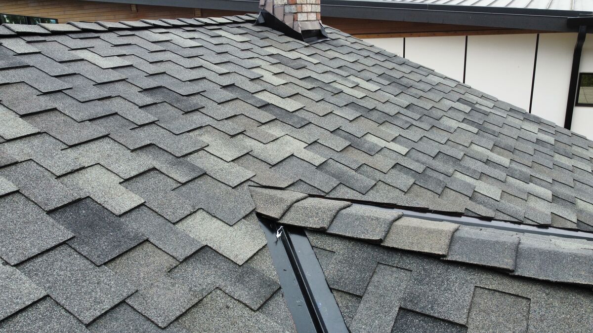 New shingles, chimney & flashing — Pierce County, WA roofing project by Zenith Construction